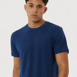 Man wearing a blue t-shirt against a white background