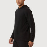 Man wearing a black hoodie and shorts on a white background