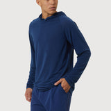 Man wearing a blue hoodie and shorts on a white background