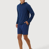 Man wearing a blue athletic outfit on a white background