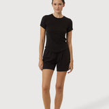 Person wearing a black t-shirt and shorts set on a white background