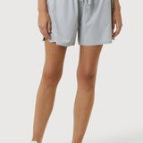 Light gray shorts worn by a person on a white background