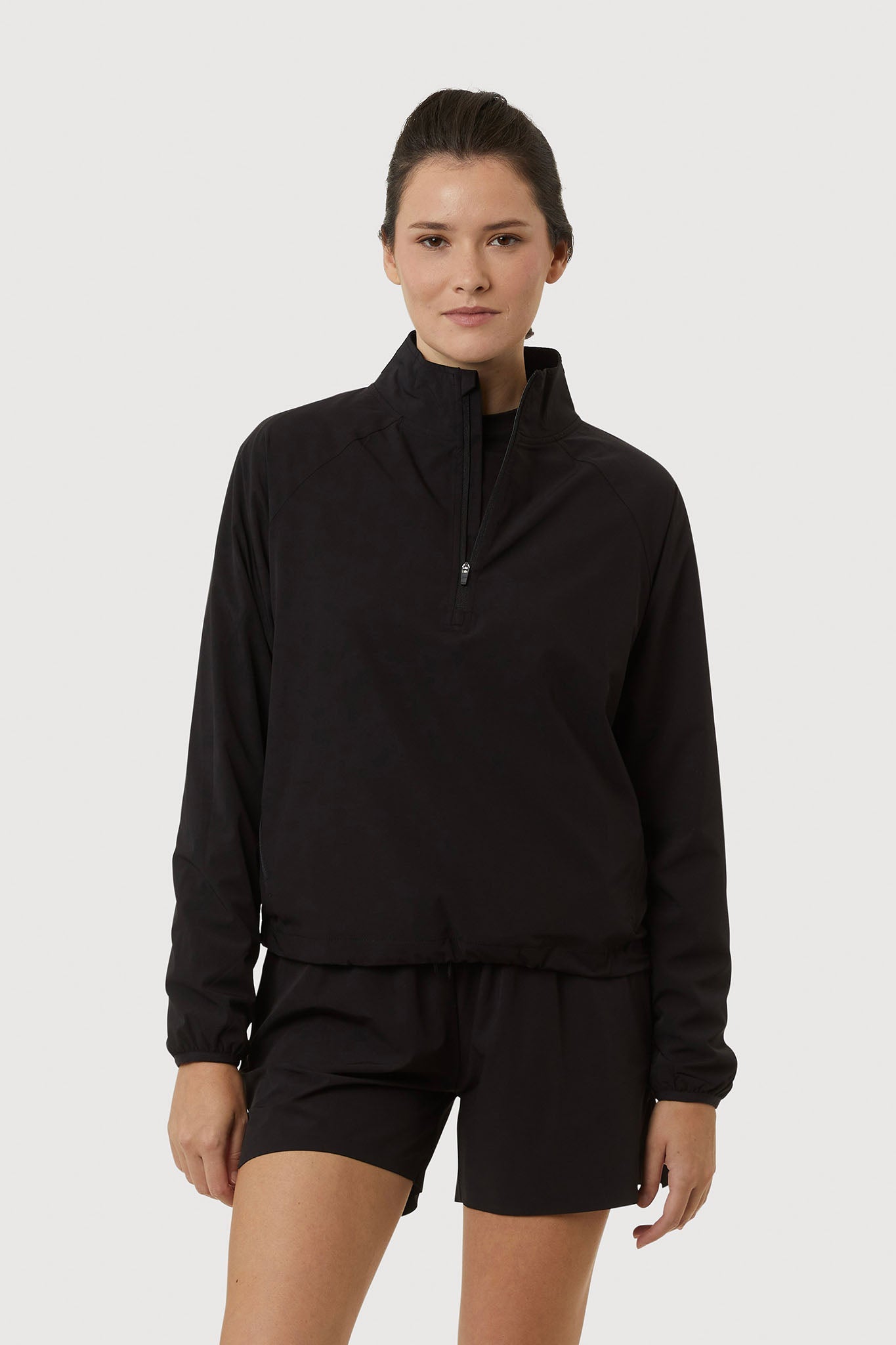 Person wearing a black outfit on a white background