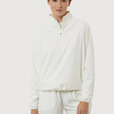 Person wearing a white zip-up sweatshirt and shorts on a light gray background