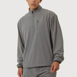 Man wearing a gray quarter-zip pullover and shorts on a white background