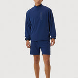 Person wearing a blue athletic outfit on a white background