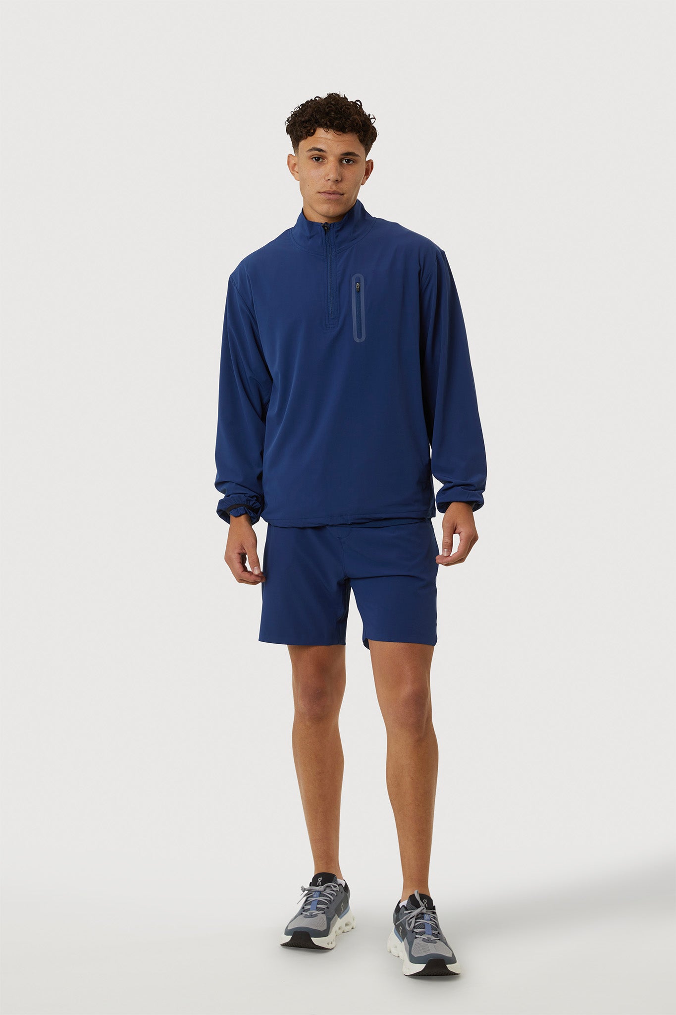 Person wearing a blue athletic outfit on a white background