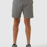 Person wearing gray shorts on a white background