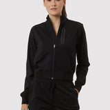 Person wearing a black tracksuit on a white background