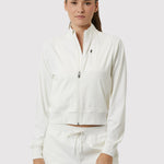 Woman wearing a white tracksuit on a white background