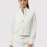 Woman wearing a white tracksuit on a white background