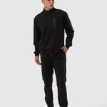 Man wearing a black tracksuit on a white background