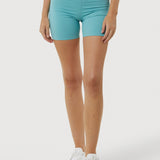 Person wearing turquoise shorts on a white background