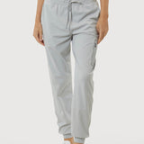 Light gray jogger pants worn by a person on a white background