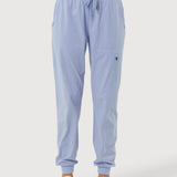 Light blue jogger pants worn by a person on a white background