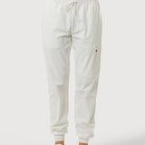 White jogger pants worn by a person on a white background