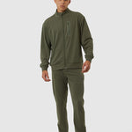 Person wearing a green tracksuit on a white background