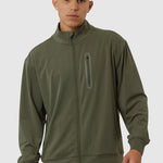 Man wearing a green tracksuit on a white background