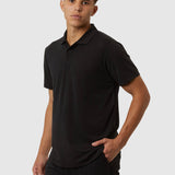 Man wearing a black polo shirt and pants on a white background