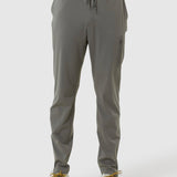 Gray jogger pants worn by a person on a white background