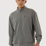 Man wearing a gray tracksuit on a white background