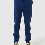 Blue jogger pants worn by a person on a white background