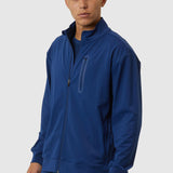 Man wearing a blue tracksuit on a white background