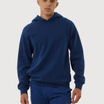 Man wearing a blue hoodie and pants on a white background