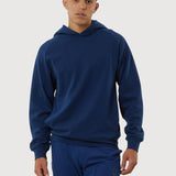 Man wearing a blue hoodie and pants on a white background