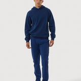 Person wearing a blue tracksuit on a white background