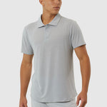 Man wearing a light gray polo shirt and pants on a white background