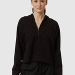 Person wearing a black outfit on a white background