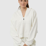 Woman wearing a white tracksuit on a white background