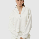 Woman wearing a white tracksuit on a white background