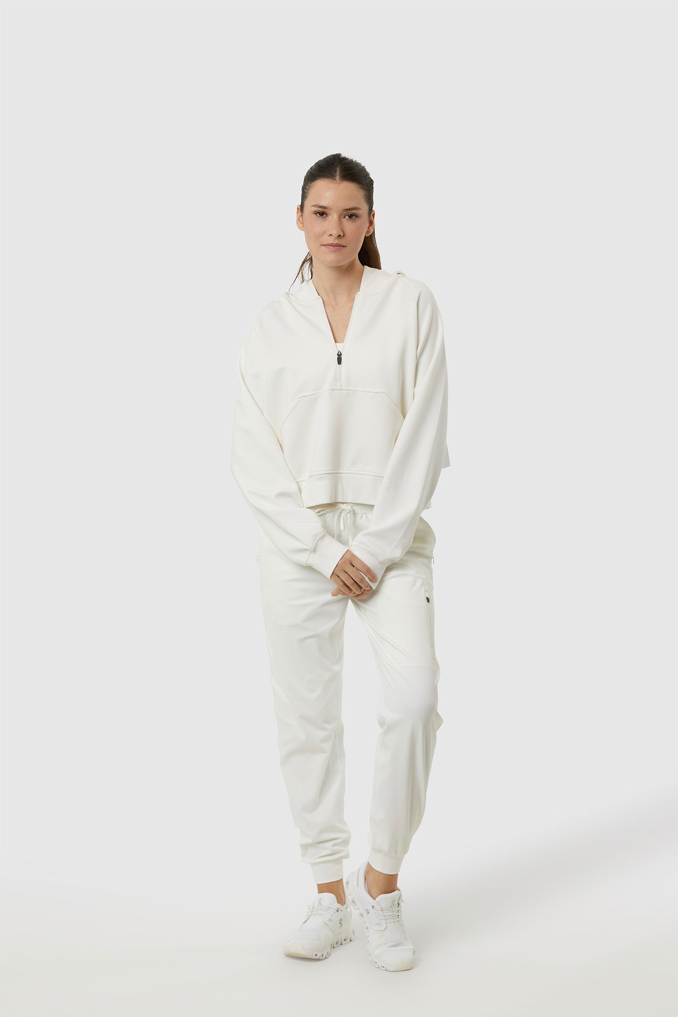 Person wearing a white outfit on a white background
